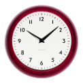 Round red wall clock with black hands and numbers,