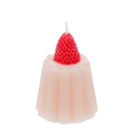 Pink jelly-shaped candle topped with a decorative red strawberry.