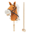 hobby horse toy with white mane and black bridle on a wooden stick