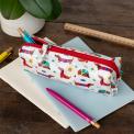Pencil case in white featuring colourful illustrations of sausage dog 