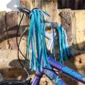 Bike streamers with blue and teal ribbons fixed in bicycle handle