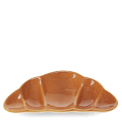 Brown ceramic trinket dish shaped like a croissant.