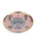 Round trinket dish with gold rim, pink background, palm tree pattern, and a leopard face design