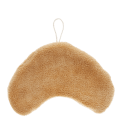Back of a brown kitchen cloth shaped like a croissant with hanging loop