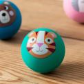 Green bouncy ball with a tiger face design