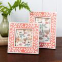picture frame with a pink border and white leaf patterns