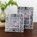 picture frame with white leaf patterns and navy blue colour on the border.