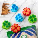 Six bright flower-shaped bag clips in blue, red, and green