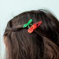 Pair of red glitter cherry hair clips with green glitter leaves