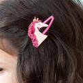 Pair of pink hair clips with glittery unicorn heads