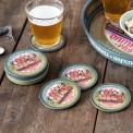 Four round coasters with vintage German beer design and storage tin
