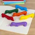 Set of six sausage dog-shaped crayons in yellow, purple, red, blue, green, and orange.