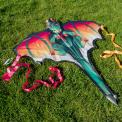 A giant dragon kite. Designed in a fantasy-inspired style with vivid colours and streaming ribbon tails