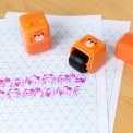 Kitten-themed roller stamp with the cap removed.