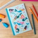 Notebook with illustrated mermaids, sea creatures, and shells on a light aqua cover.
