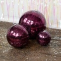 Plum hanging disco ball ornament with mirrored tiles shown in different sizes.