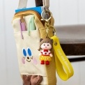 Strawberry girl bag charm with yellow polka dot skirt, silicone wrist strap and keyring