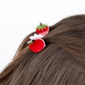 Set of two mini fruit-shaped hair claw clips in strawberry and apple designs.