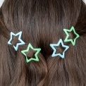 Blue and green star hair clips in a set of four.