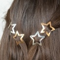 Gold and silver star hair clips in a set of four.