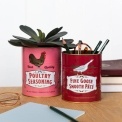 Set of two retro-style storage tins with poultry seasoning and goose pâté designs