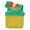 Inside of children’s backpack showing yellow lining, inner pocket, snap closure, and patterned flap