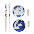 Two cat-themed dipping bowls, two pairs of chopsticks, and two cat-shaped rests.