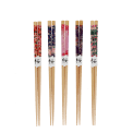five pairs of wooden chopsticks with colorful floral designs
