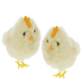 Two fluffy yellow chick decorations sitting side by side