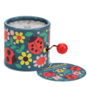 Winding music box with illustrated flowers and ladybird design, featuring a red turning handle with tag.