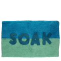 Blue and green bath mat with the word ‘SOAK’ in the center.