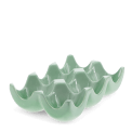 Green ceramic egg holder with six curved compartments for storing eggs