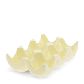 Yellow ceramic egg holder with six curved compartments for storing eggs