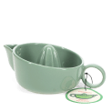 Green stoneware lemon squeezer with handle, spout and an attached product tag.