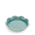 Ceramic trinket dish with a scalloped edge and a floral design in the centre.