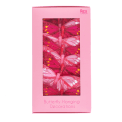 Butterfly hanging decorations in a pink gift box.
