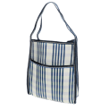 Blue and white striped woven bag with a front pocket and shoulder strap.