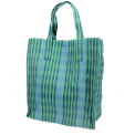 Green and blue striped woven shopping bag with handles.