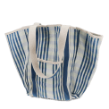 Blue and white striped woven tote bag with canvas handles.
