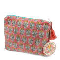 Pink quilted wash bag with orange and green flowers design and a tag.