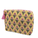 Yellow quilted wash bag with a pink and green flowers design.