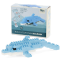 Completed dolphin brick model displayed beside its packaging box.