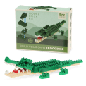 Completed crocodile brick model displayed beside its packaging box.