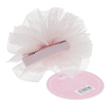 Bottom view of a pink mesh hair clip with a ribbed metal clasp and an attached product tag.