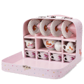 Unicorn ceramic tea set neatly stored in a pink suitcase.