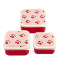 Set of three red snack boxes with cream lids featuring a cherry print.