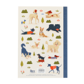 Notebook with illustrated dogs in a park scene on the cover.