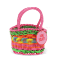 A small woven plastic basket with a pink handle and multicoloured striped body with tag.