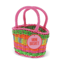A small woven plastic basket with a pink handle and multicoloured striped body with tag.