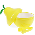 Yellow pear-shaped ice bucket with green leaf lid and matching tongs.